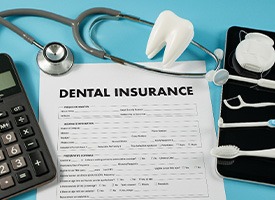 Chevy Chase patient looking over dental insurance paperwork