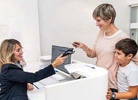Patient in Chevy Chase smiling after getting affordable dentures