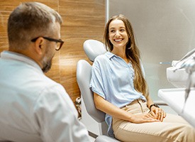 Lady smiles at dentist
